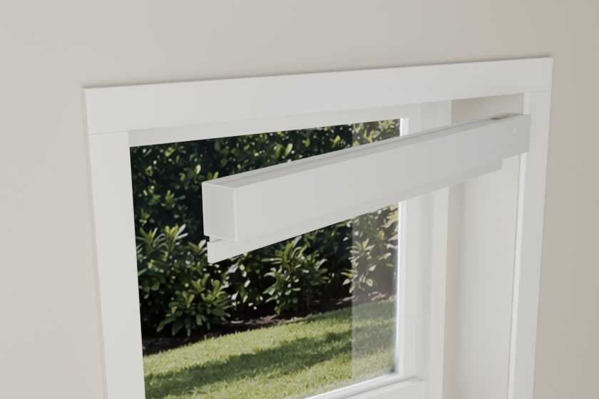 The shade tilts up into the window. Its right end presses into the frame.