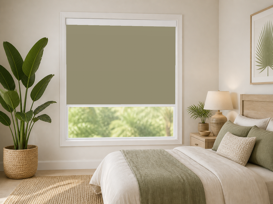 Sage blackout roller shade in a bedroom