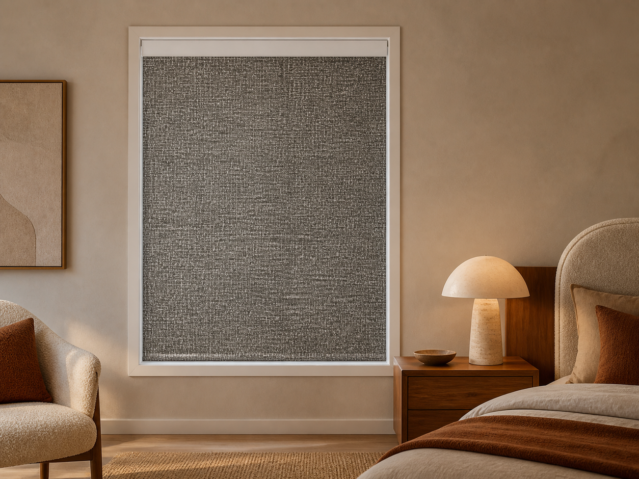 Bronze textured blackout roller shade in an organic modern bedroom