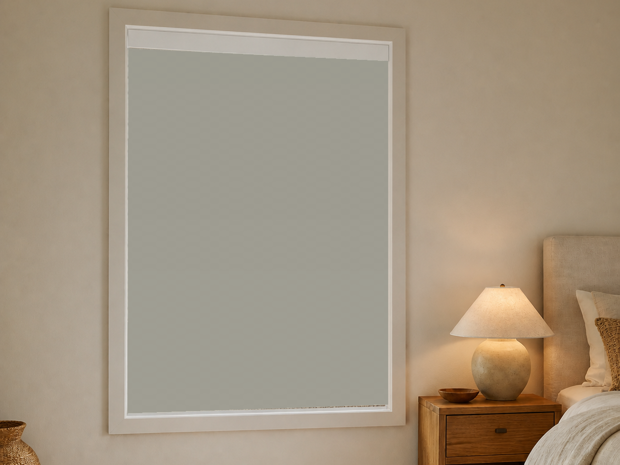 Blackout roller shade in a warm coastal bedroom