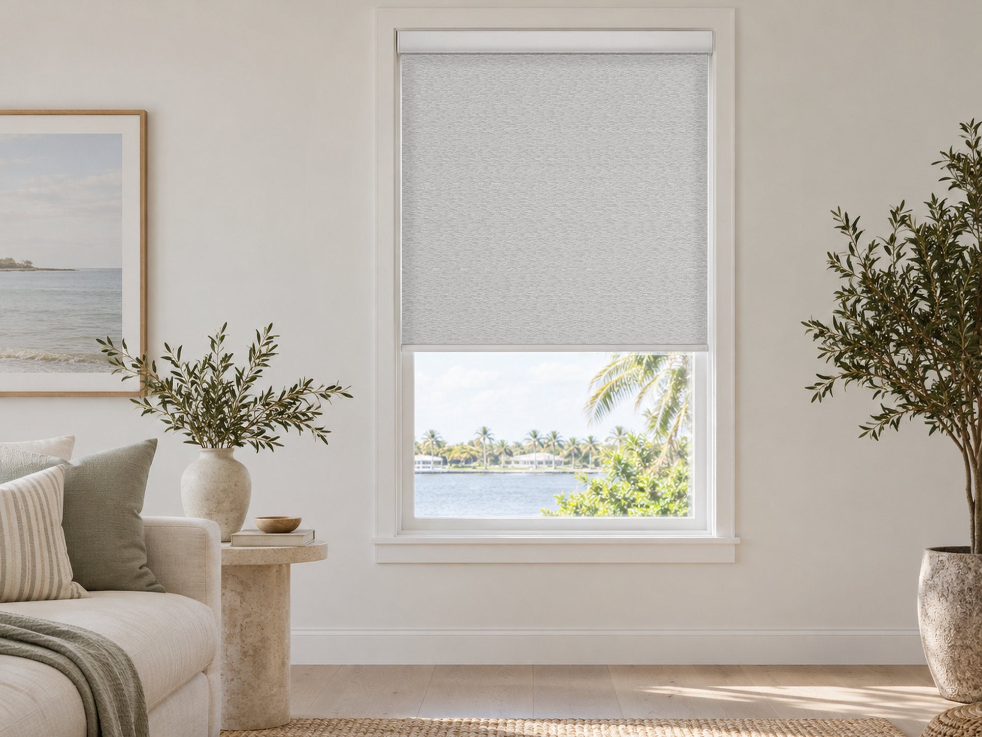 Silver mosaic light-filtering roller shade in a coastal living room